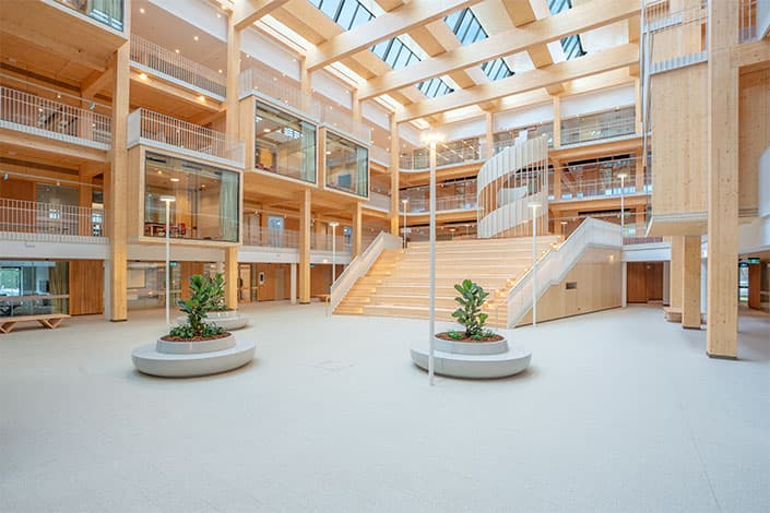 Macquarie University law building atrium with timber beams and natural light